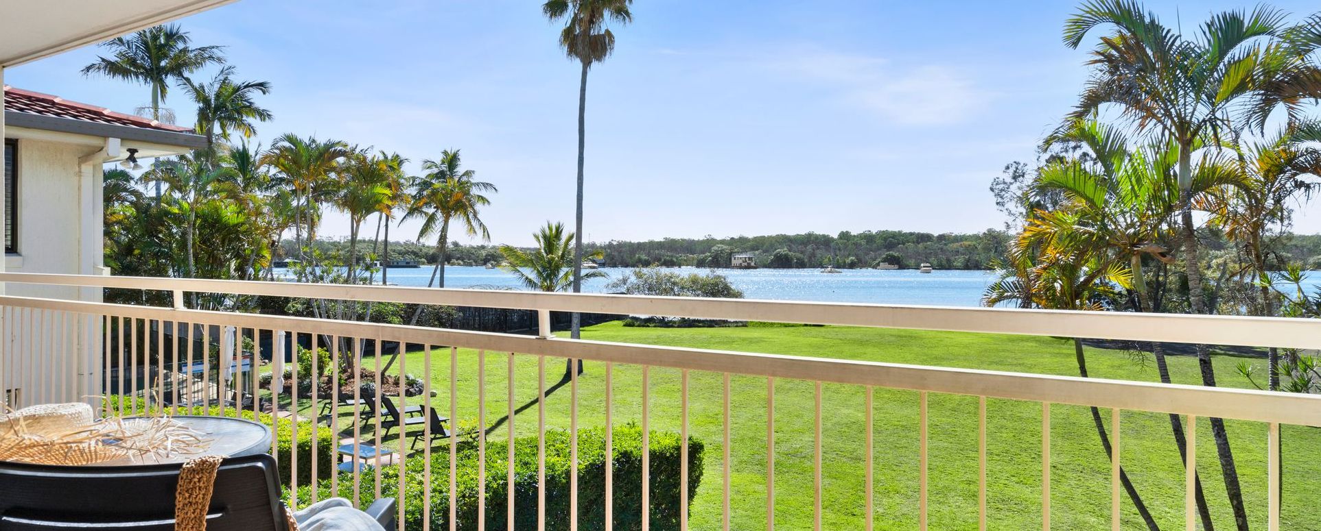Direct Noosa River View from Private Balcony Scenic view of the absolute waterfront and pristine parklands of the Noosa River taken directly from a private apartment balcony at Cayman Quays Noosaville