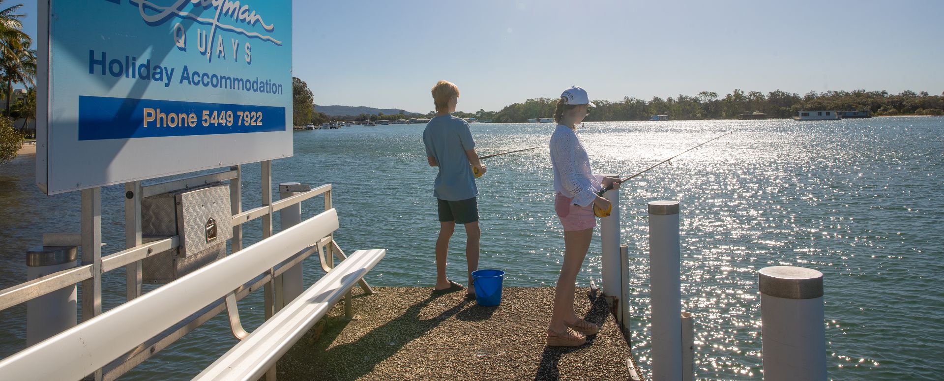 Fishing from our Private Riverfront Jetty Guests enjoying complimentary fishing rod hire from the private jetty at Cayman Quays self-contained apartments on the Noosa River.